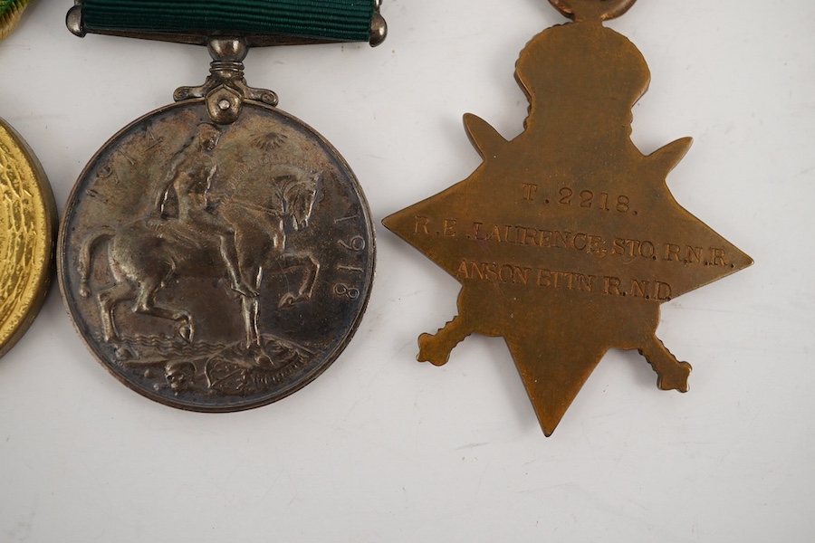 A First World War medal trio and Naval Reserve Long Service medal awarded to R.E.A. Lawrence ENGN RNR. Condition - fair.